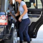 Kaley Couco yoga pants, getting out of a black SUV.
