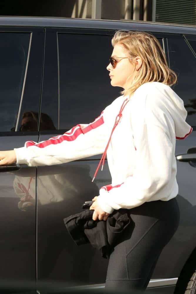 tight yoga pants black chloe moretz range rover side view