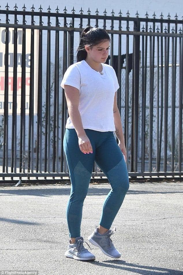 tight teal yoga pants sidewalk walk